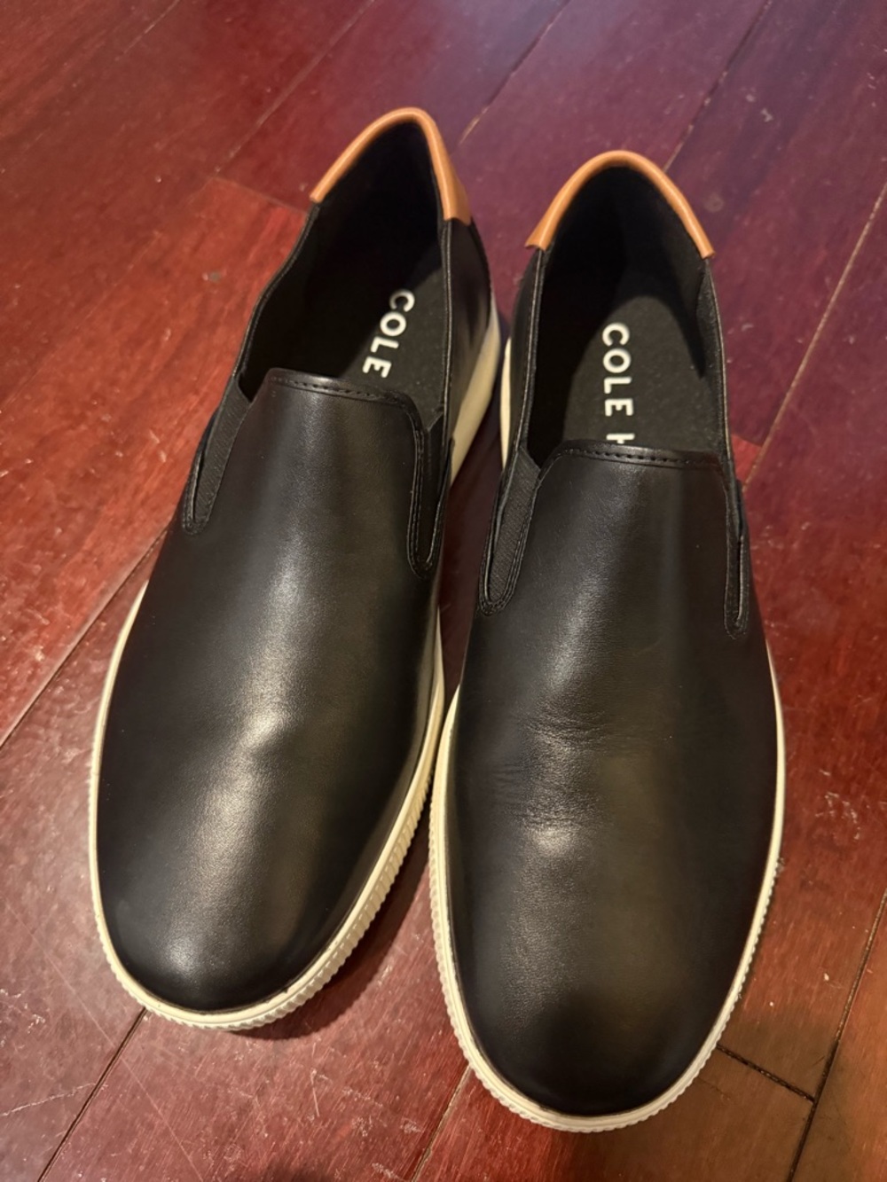 Cole Haan Black Leather Slip-On Sneakers with Tan Heel Tab